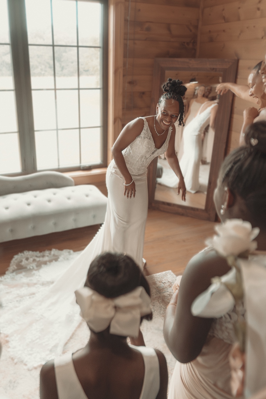 The bride shares a joyful getting-ready moment with her wedding party