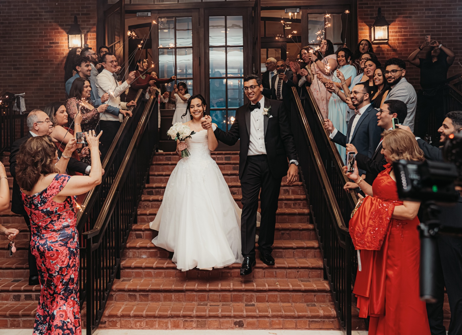 A bride and groom share the aisle with their wedding guests