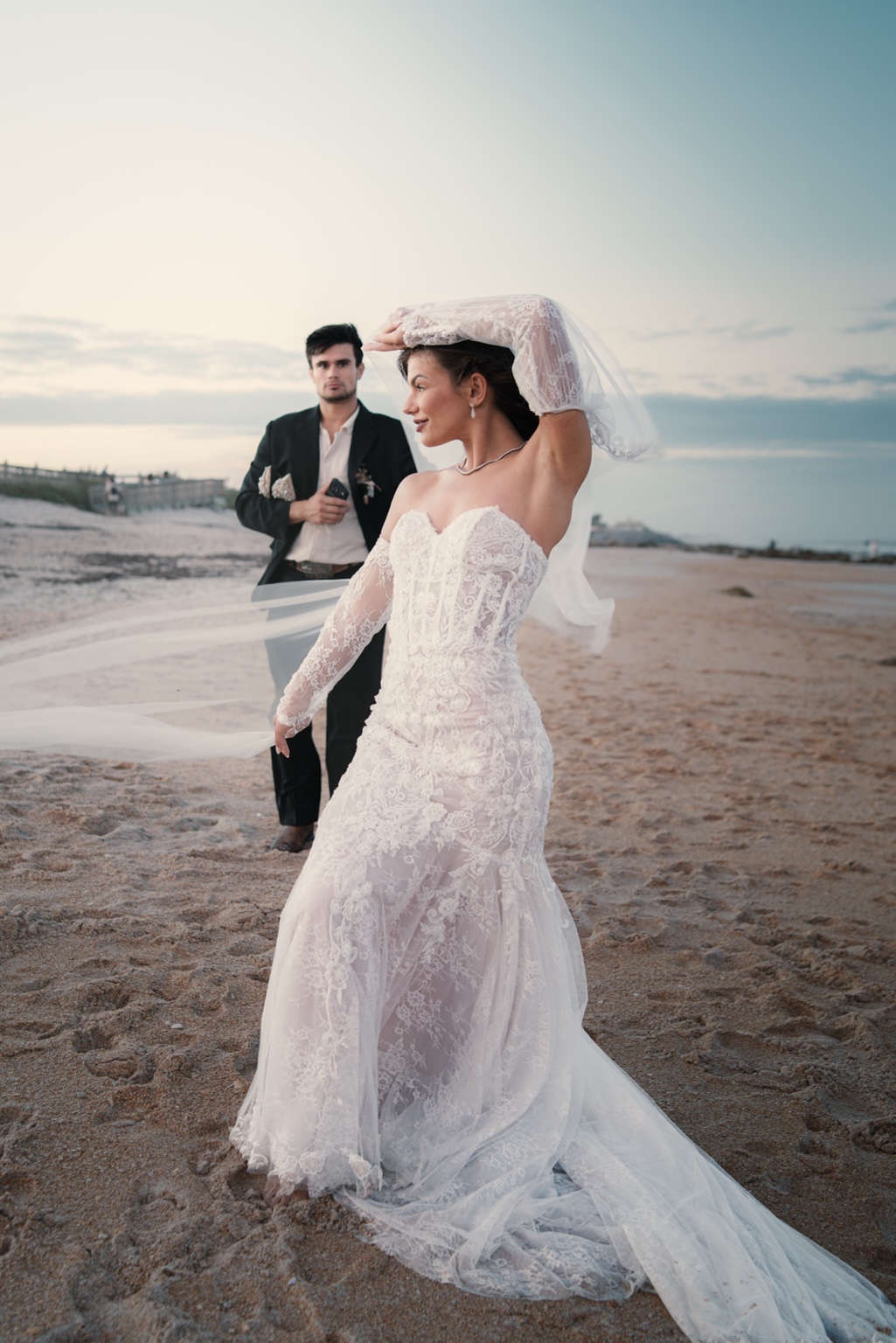 A couple celebrating their elopement by the water in Daytona Beach, Florida